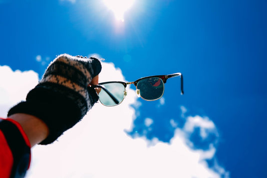 glasses with a clear lens and a dark lens to what a photochromatic lens is